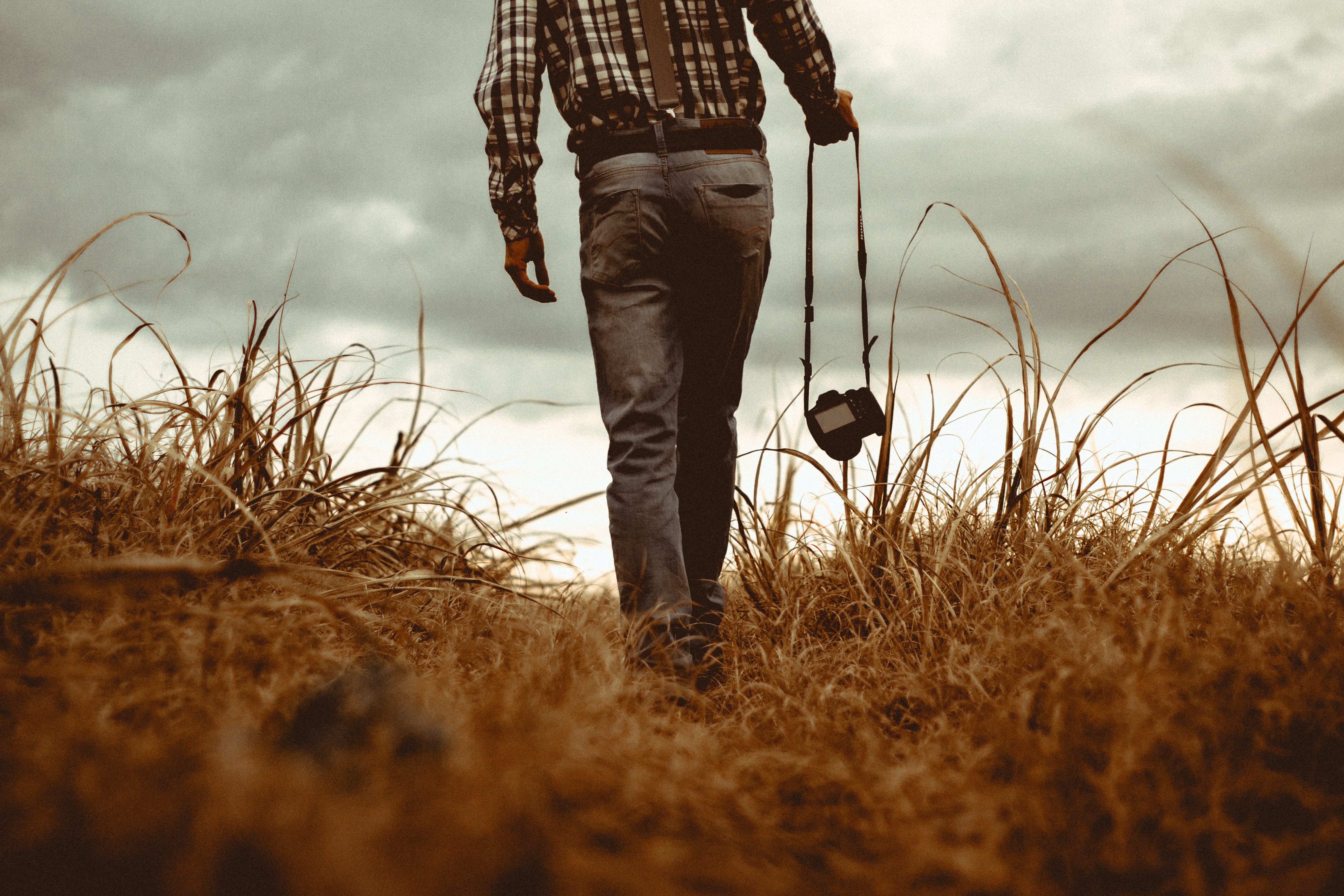 man walking with camera vintage