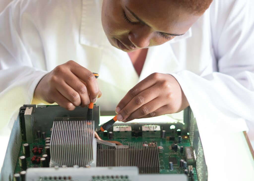 person working on server board computer